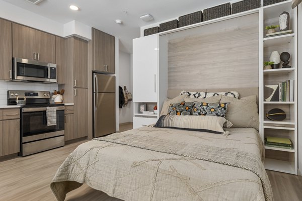 Elegant kitchen with stainless steel appliances in Vero Tempe Apartments