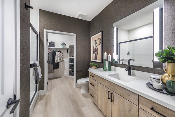 Modern kitchen with stainless steel appliances and granite countertops in Marlowe Centennial Hills Apartments