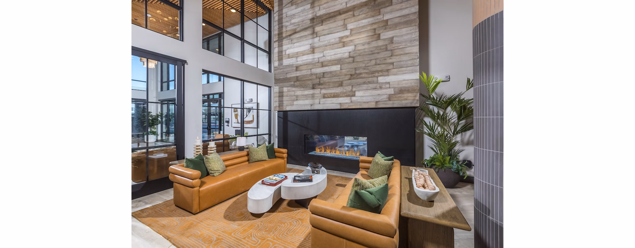Chic clubhouse at Marlowe Centennial Hills Apartments with modern seating and open space, ideal for community gatherings and events