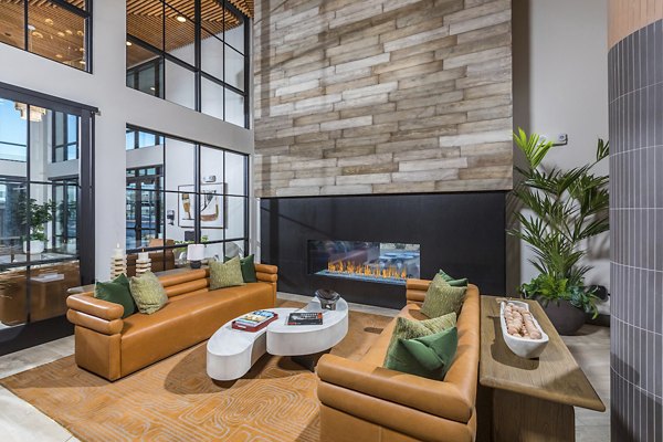 Chic clubhouse at Marlowe Centennial Hills Apartments with modern seating and open space, ideal for community gatherings and events