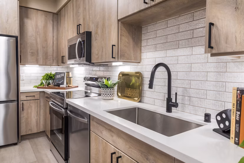 Open-concept kitchen with stainless steel appliances at Marlowe Centennial Hills Apartments Perfect for modern luxury living