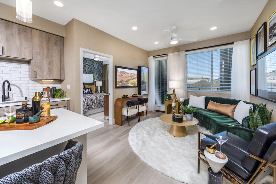 Spacious living room with modern decor and large windows in Marlowe Centennial Hills Apartments