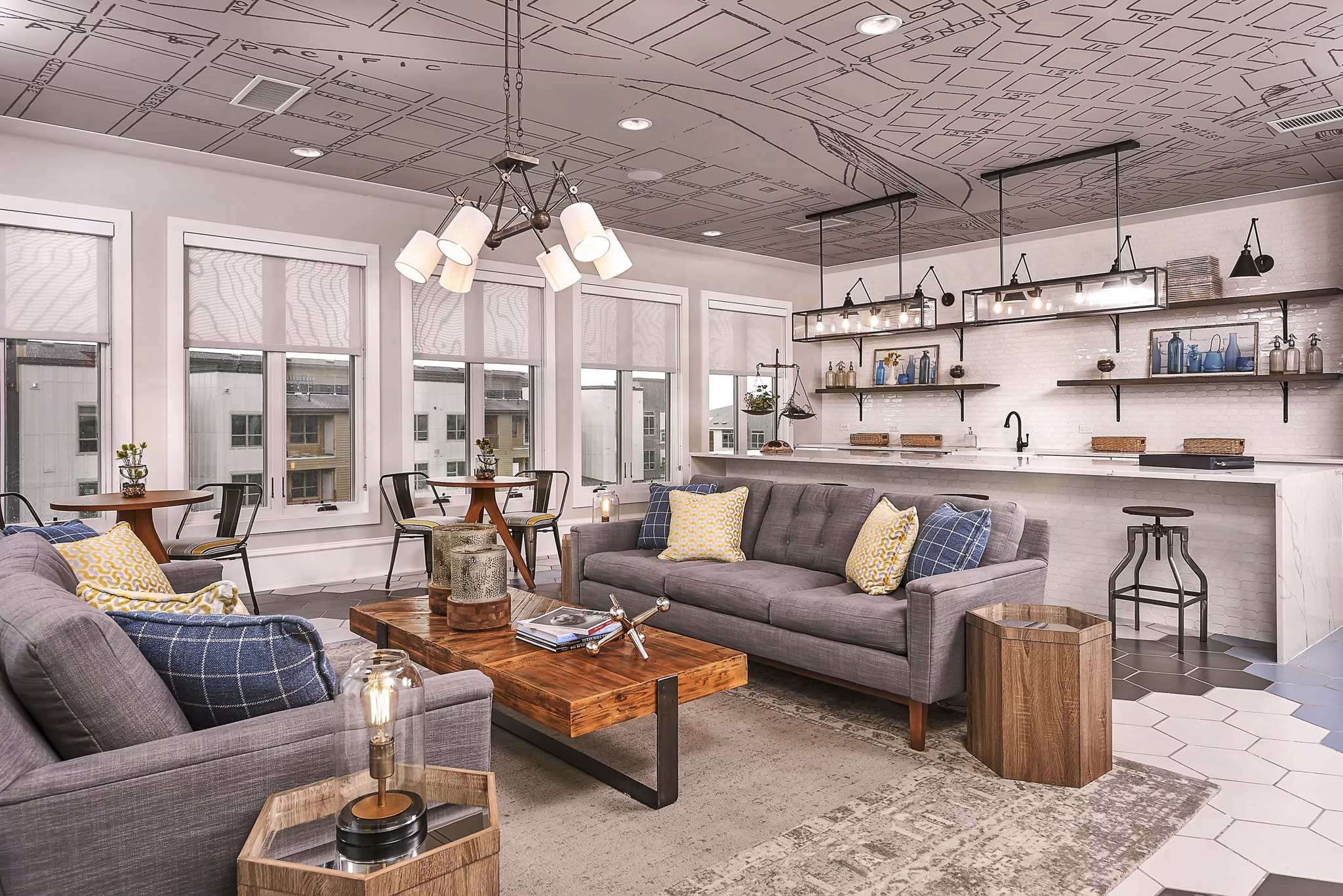 The Kelley: Elegant clubhouse with modern furnishings at Samuels Avenue Apartments, perfect for gatherings and social events