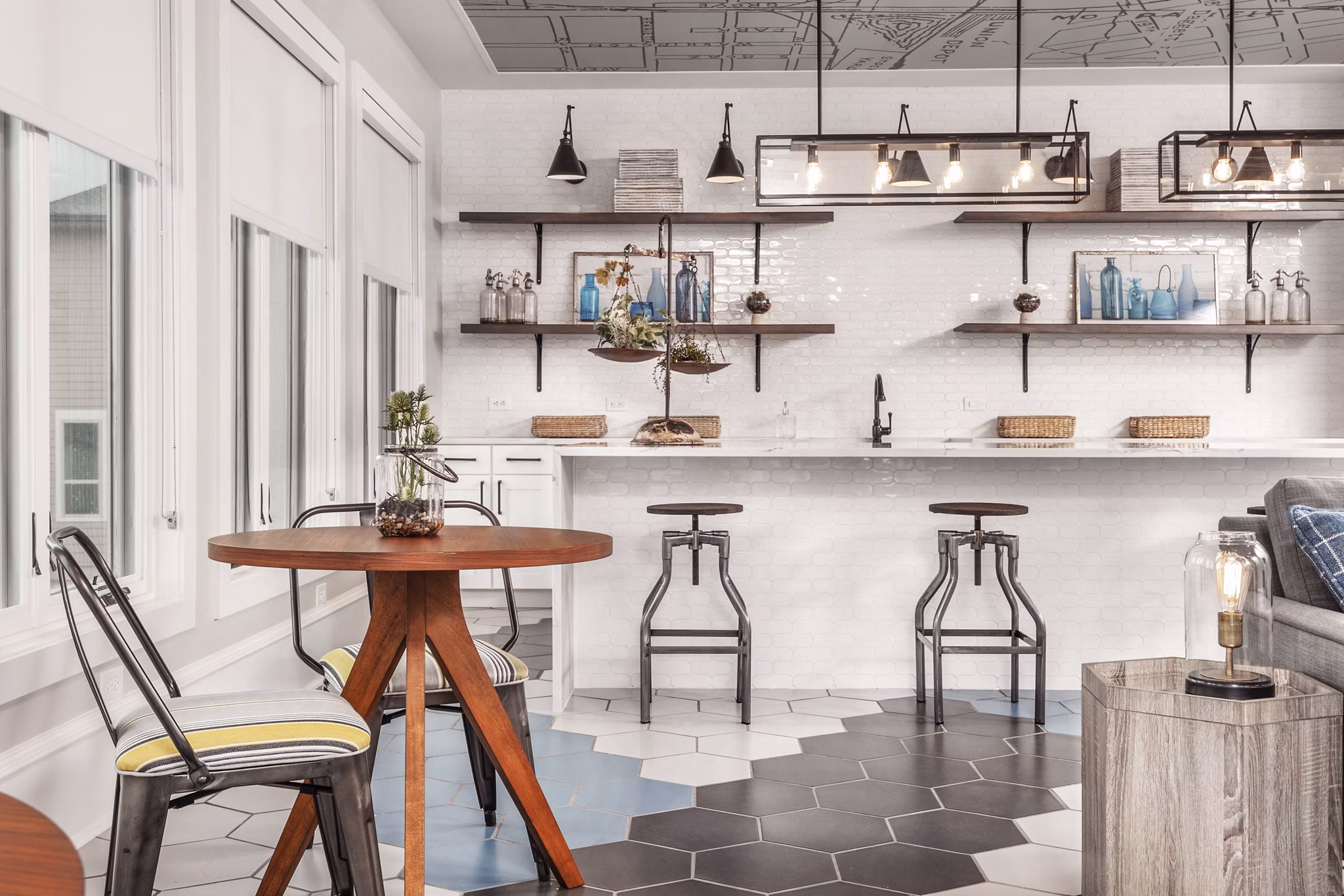 Clubhouse lounge with plush seating and modern decor at The Kelley at Samuels Avenue Apartments