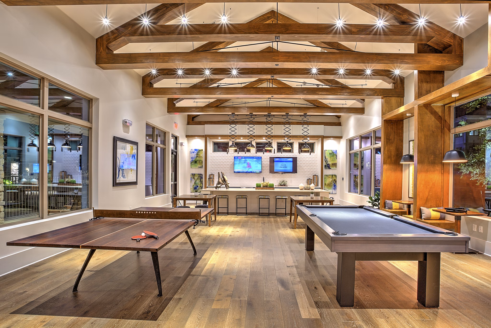 Elegant clubhouse with modern furnishings at The Kelley at Samuels Avenue Apartments, offering luxury communal spaces for residents