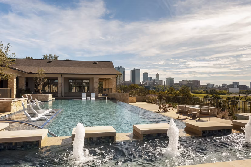Rooftop pool with skyline views at The Kelley at Samuels Avenue Apartments