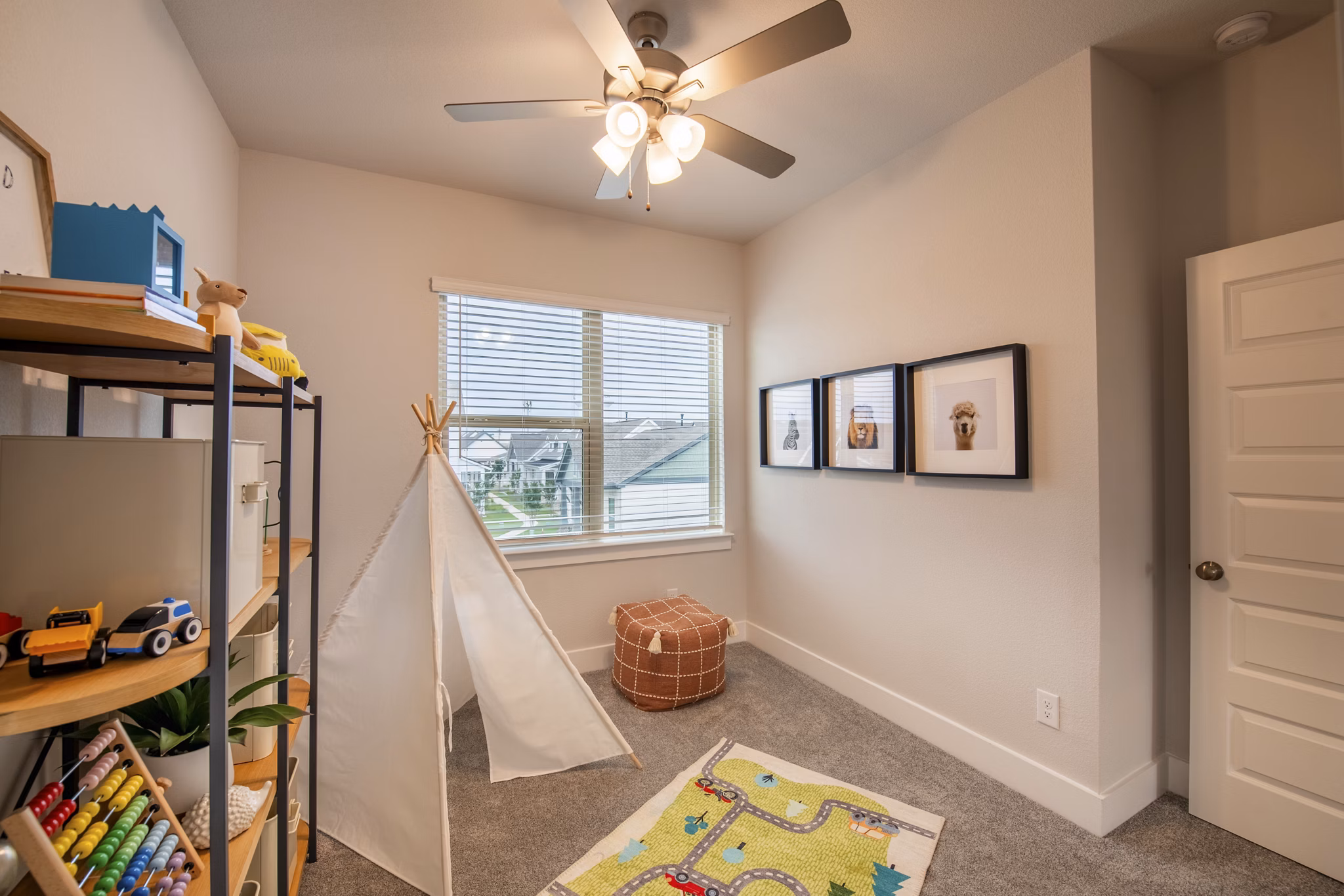 Cozy bedroom featuring modern decor at Mission at Johnson Creek Apartments with plush bedding and ample natural light
