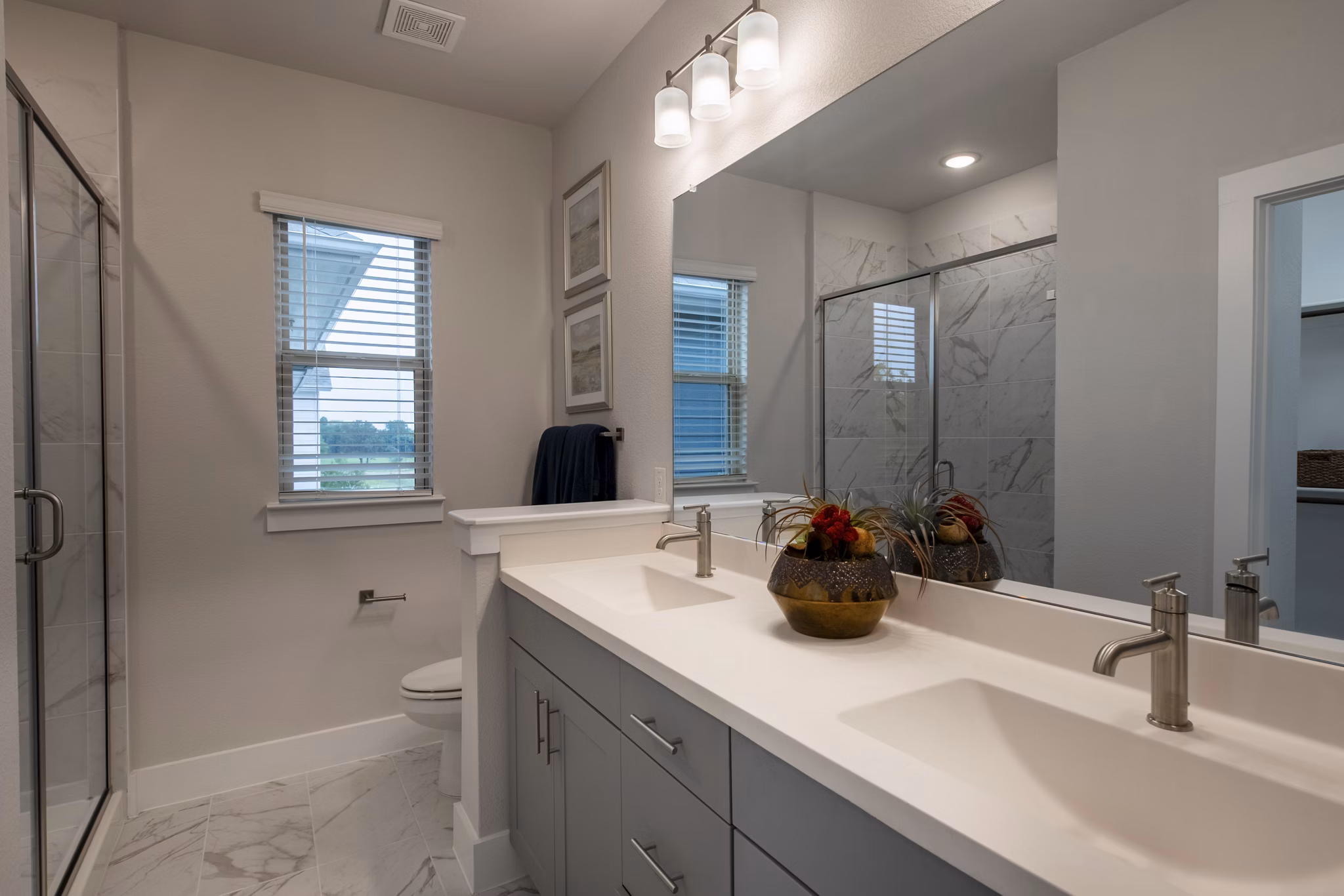 Contemporary bathroom with elegant fixtures at Mission at Johnson Creek Apartments