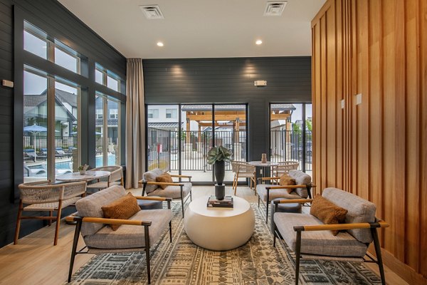 Clubhouse with modern lounge spaces at Mission at Johnson Creek Apartments, luxury living in a vibrant community