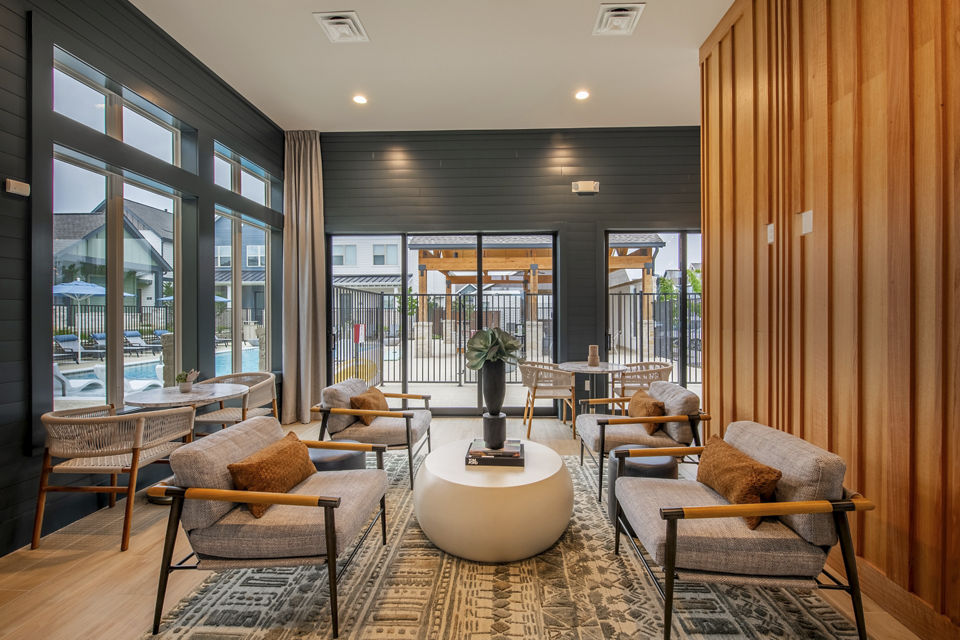 Clubhouse with modern lounge spaces at Mission at Johnson Creek Apartments, luxury living in a vibrant community