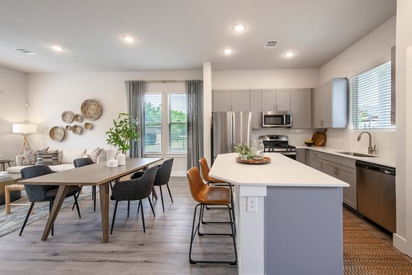 Modern kitchen featuring stainless steel appliances at Mission at Johnson Creek Apartments