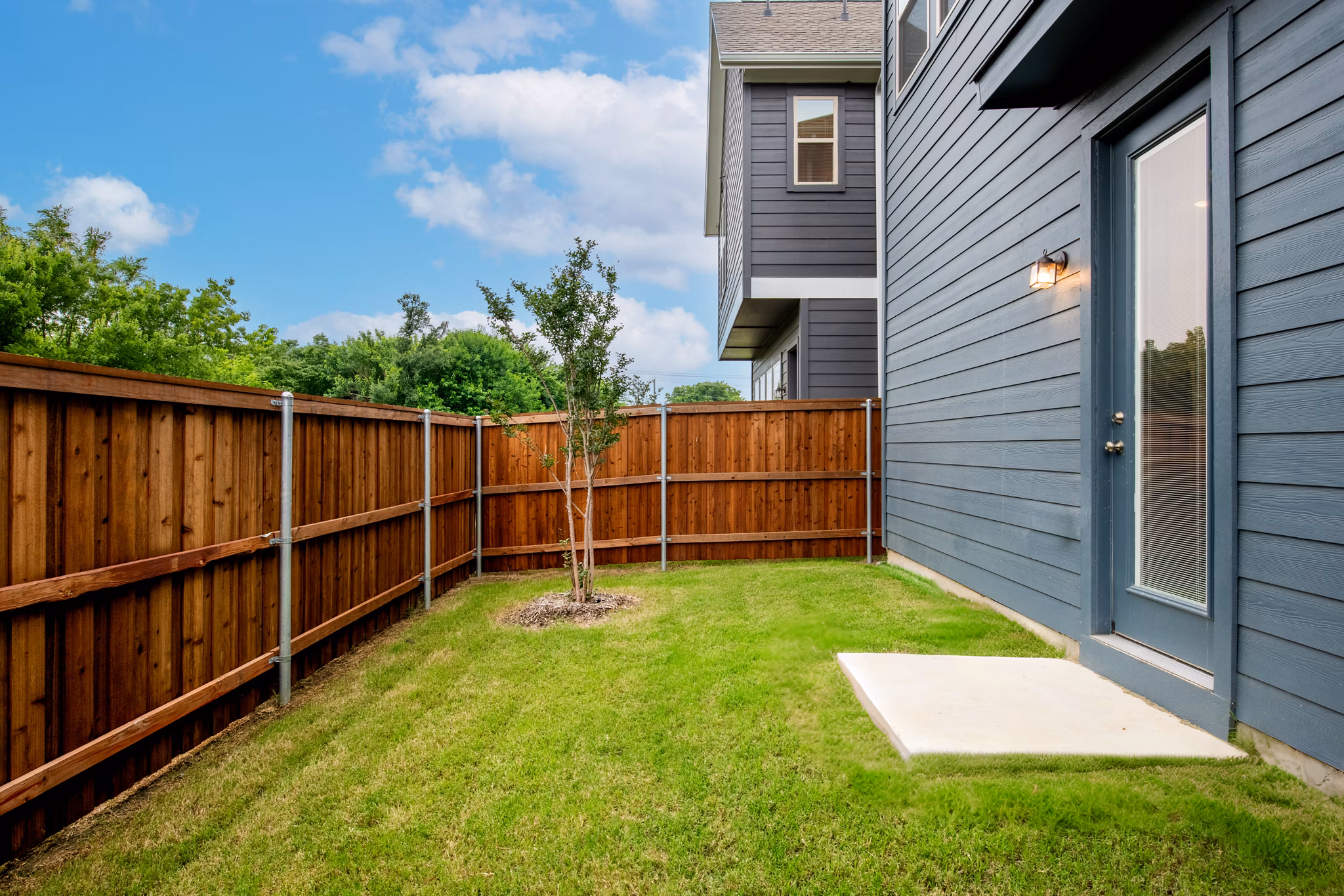 Patio with cozy seating at Mission at Johnson Creek luxury apartments