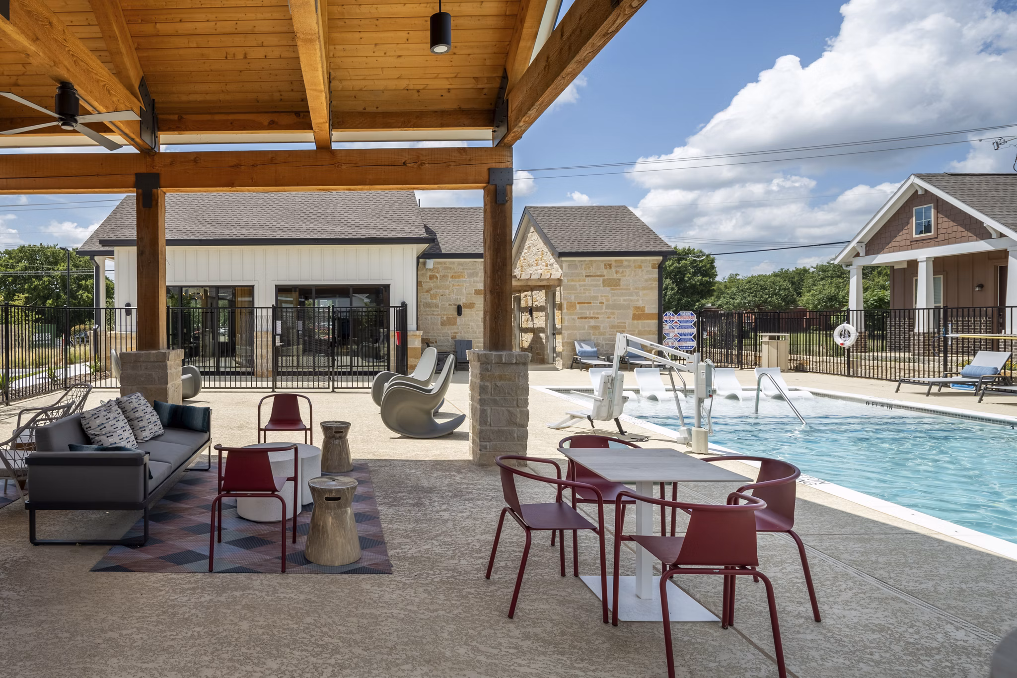 Outdoor patio with comfortable seating at Mission at Johnson Creek Apartments, ideal for relaxing and social gatherings