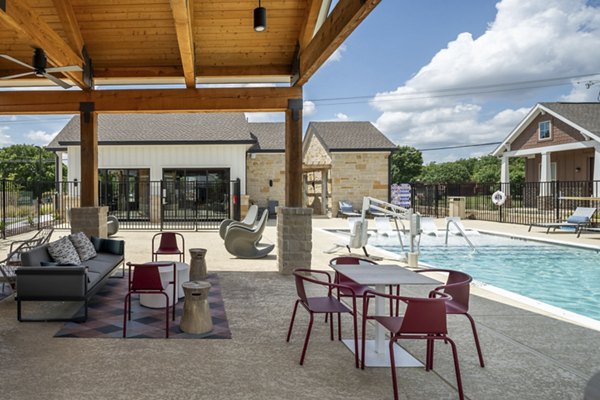 Outdoor patio with comfortable seating at Mission at Johnson Creek Apartments, ideal for relaxing and social gatherings