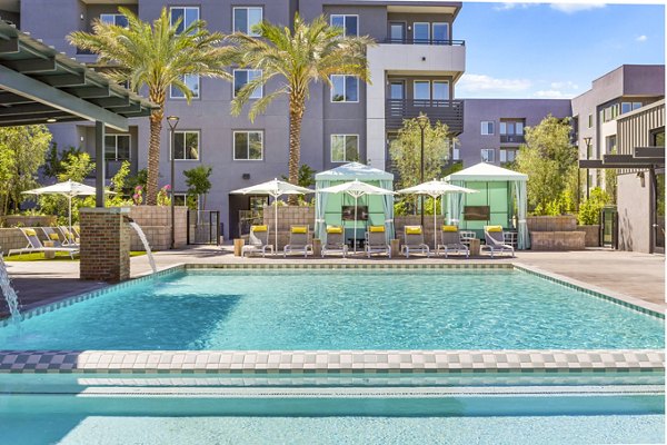 Luxurious pool with lounge chairs at Broadstone Uptown Apartments, perfect for relaxation and leisure in a vibrant community setting