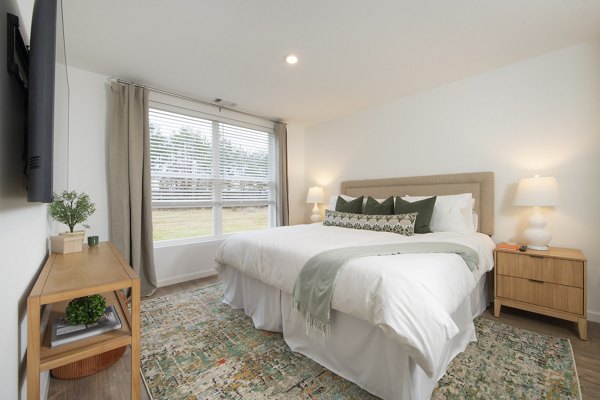 Spacious bedroom with modern decor at Ltd Findlay Apartments, luxury living by Greystar