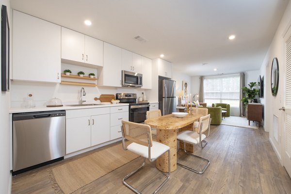 Modern kitchen with stainless steel appliances at Ltd Findlay Apartments, luxury living by Greystar