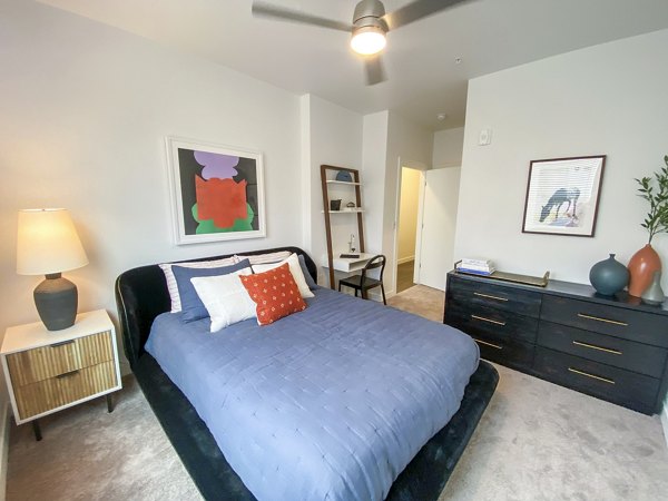 Cozy bedroom with modern decor in Lariat Apartments