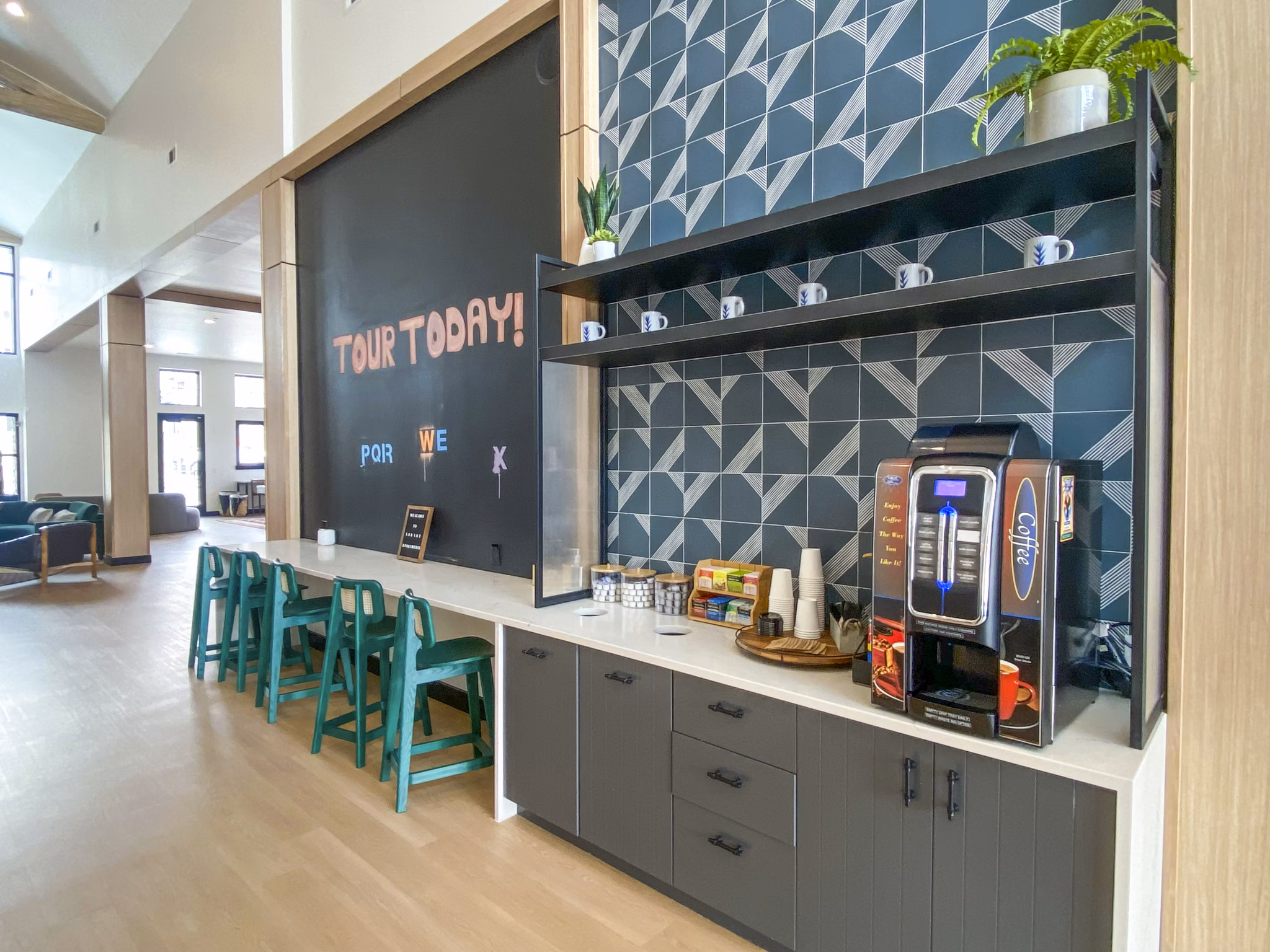 Clubhouse lobby featuring modern decor and cozy seating at Lariat Apartments, a luxury Greystar property