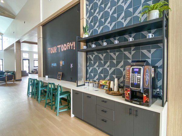 Clubhouse lobby featuring modern decor and cozy seating at Lariat Apartments, a luxury Greystar property