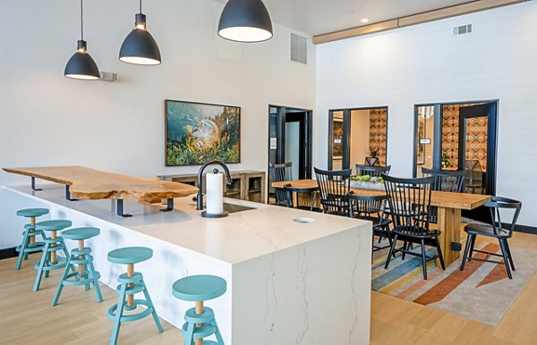 Lariat Apartments: Stylish clubhouse lobby with contemporary furnishings and ambient lighting