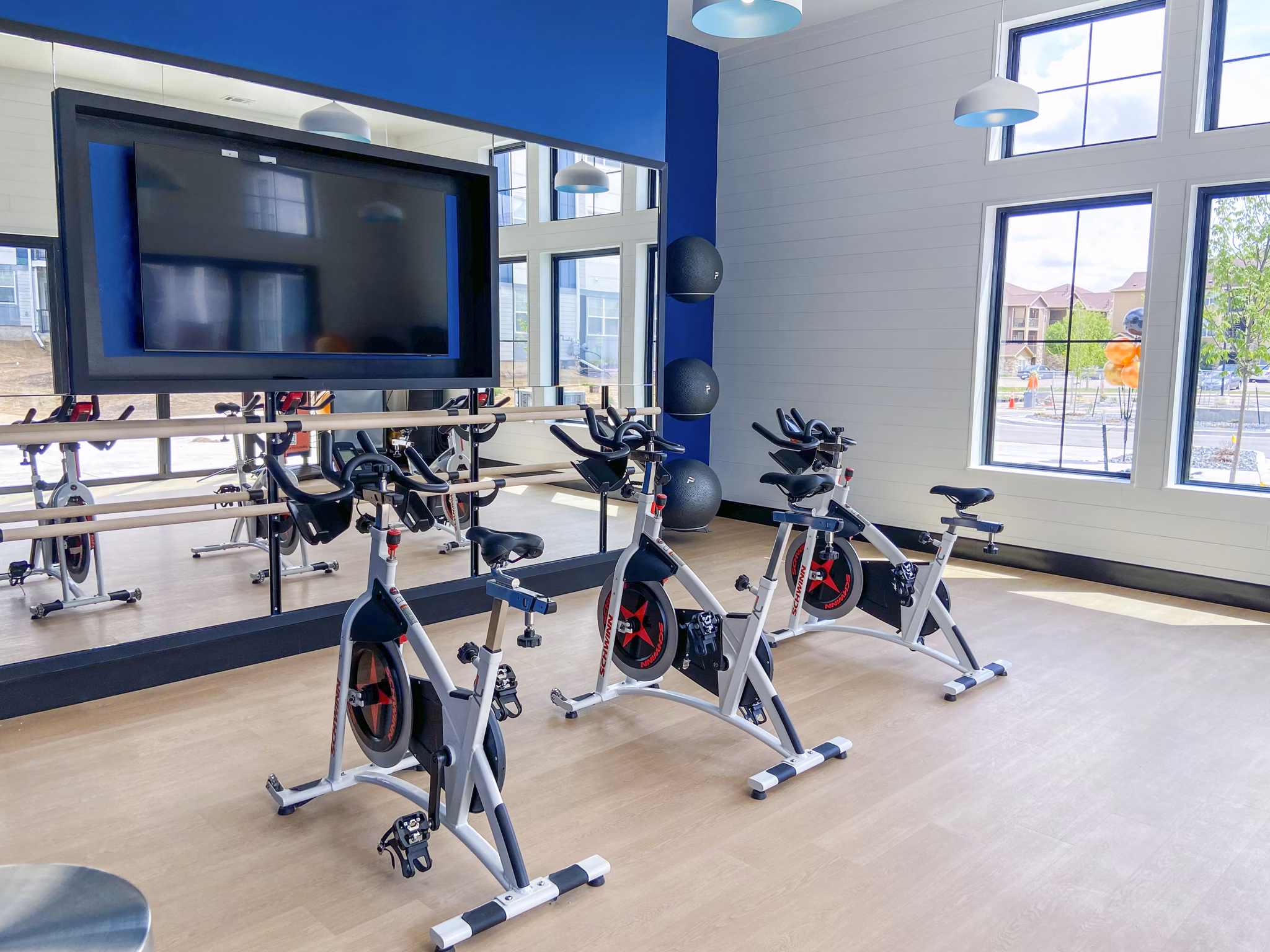 Yoga and spin studio featuring modern equipment at Lariat Apartments, Greystar luxury community in a prime location