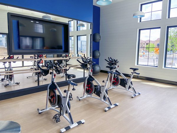 Yoga and spin studio featuring modern equipment at Lariat Apartments, Greystar luxury community in a prime location
