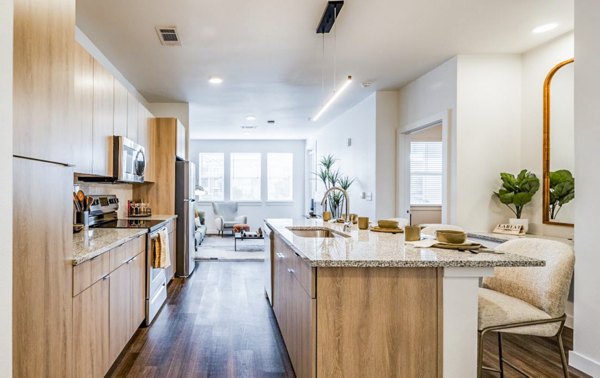 Modern kitchen with stainless steel appliances at Lariat Apartments