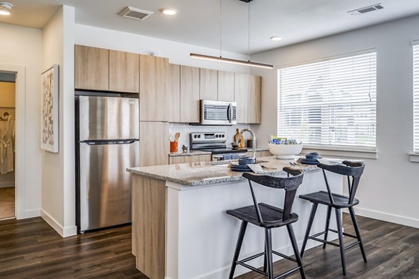 Modern kitchen with stainless steel appliances at Lariat Apartments, part of Greystar's luxury living collection