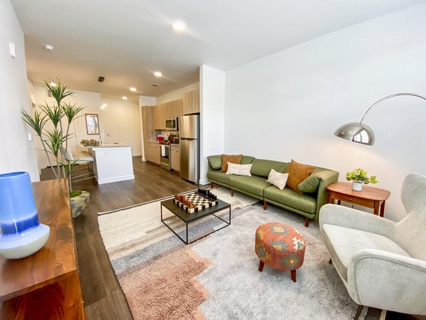 Modern living room with sleek design elements at Lariat Apartments featuring luxurious finishes and ample natural light