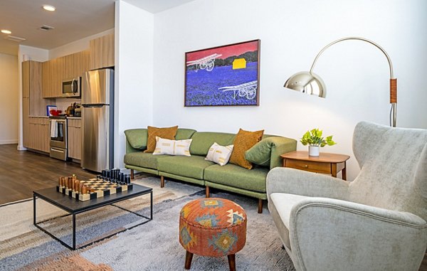Spacious living room with modern furnishings in Lariat Apartments, a luxury property by Greystar