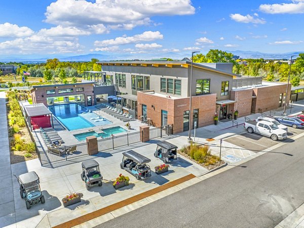 Luxury apartment building with a swimming pool and outdoor seating area