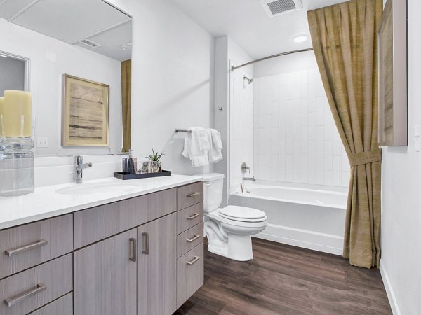 Bathroom with elegant fixtures and modern design at Railway Flats Apartments