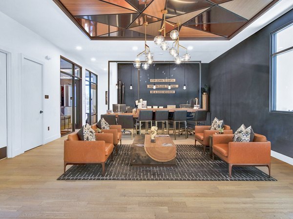 Railway Flats Apartments: Elegant clubhouse interior with modern decor and seating for luxury living