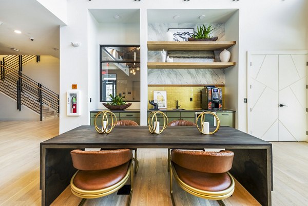 Clubhouse with modern design and cozy seating at Railway Flats Apartments