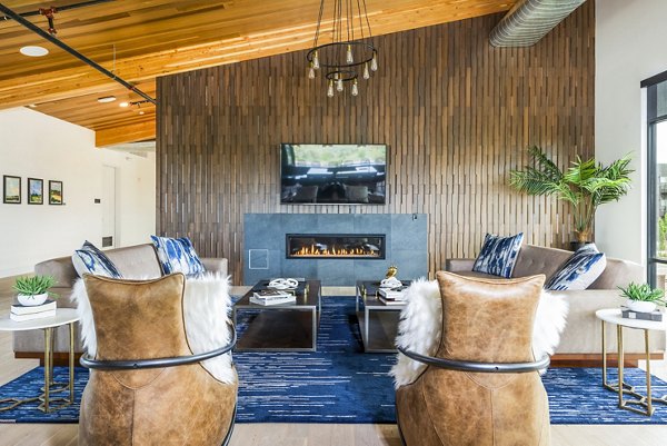 Clubhouse featuring modern design and open lounge spaces at Railway Flats Apartments