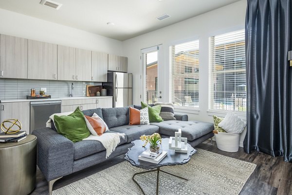 Living room with contemporary decor and natural lighting at Railway Flats Apartments in downtown Denver