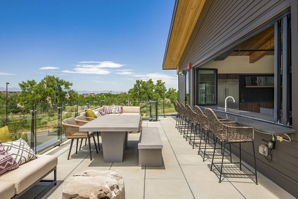 Private patio with modern seating at Railway Flats Apartments featuring outdoor relaxation for residents