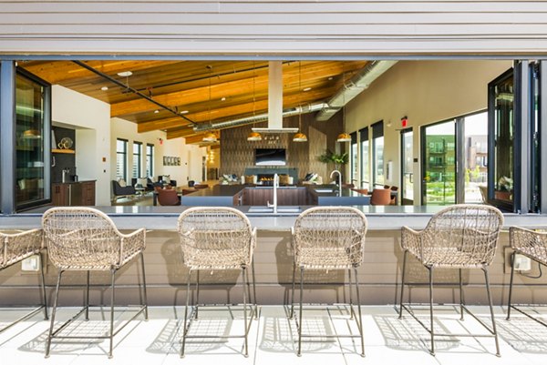 Patio with modern furniture at Railway Flats Apartments offering luxury living in a scenic setting