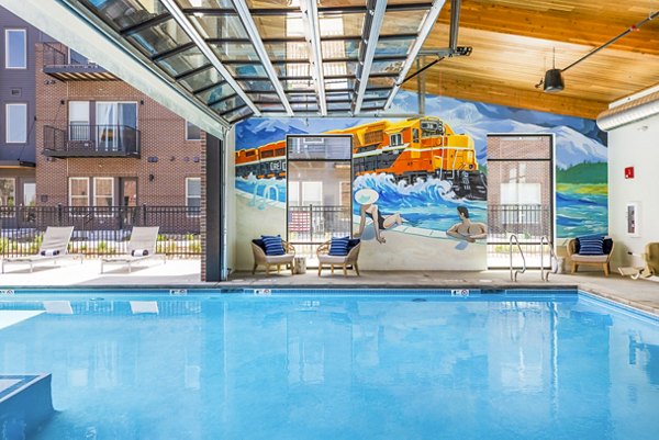 Poolside relaxation with comfortable seating at Railway Flats Apartments