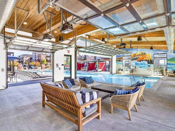 Pool and cabana with lounge seating at Railway Flats Apartments, luxury living community