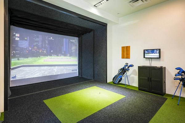 Virtual golf driving range at Railway Flats Apartments: state-of-the-art indoor amenity for residents' enjoyment and convenience