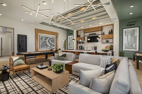 Delhaven Pointe Apartments: Modern clubhouse featuring a cozy lounge and meeting spaces