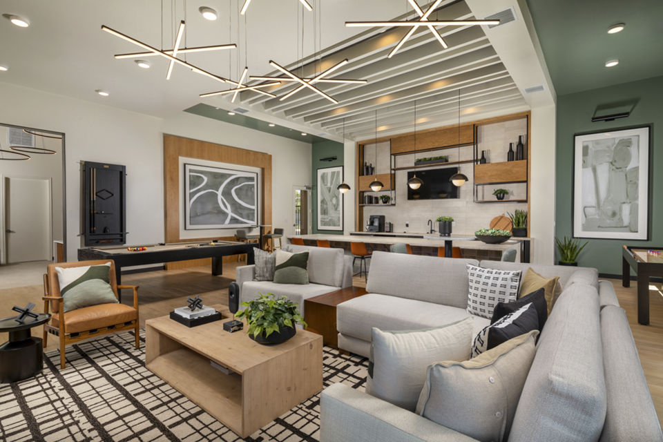 Delhaven Pointe Apartments: Modern clubhouse featuring a cozy lounge and meeting spaces