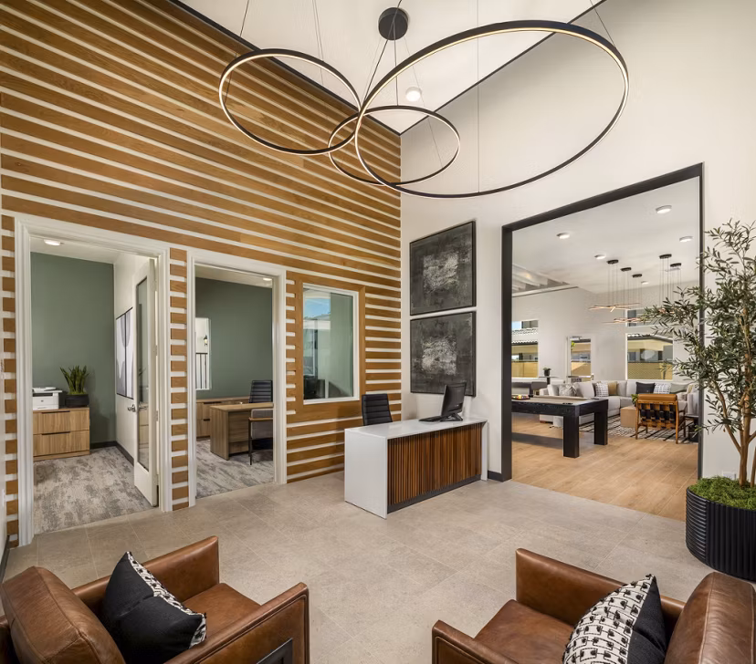 Clubhouse with modern furnishings and cozy seating at Delhaven Pointe Apartments