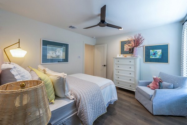 Modern bedroom with stylish decor at Eden at Sunterra Apartments