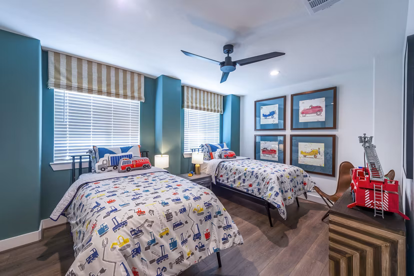 Spacious bedroom with modern decor and natural light at Eden at Sunterra Apartments