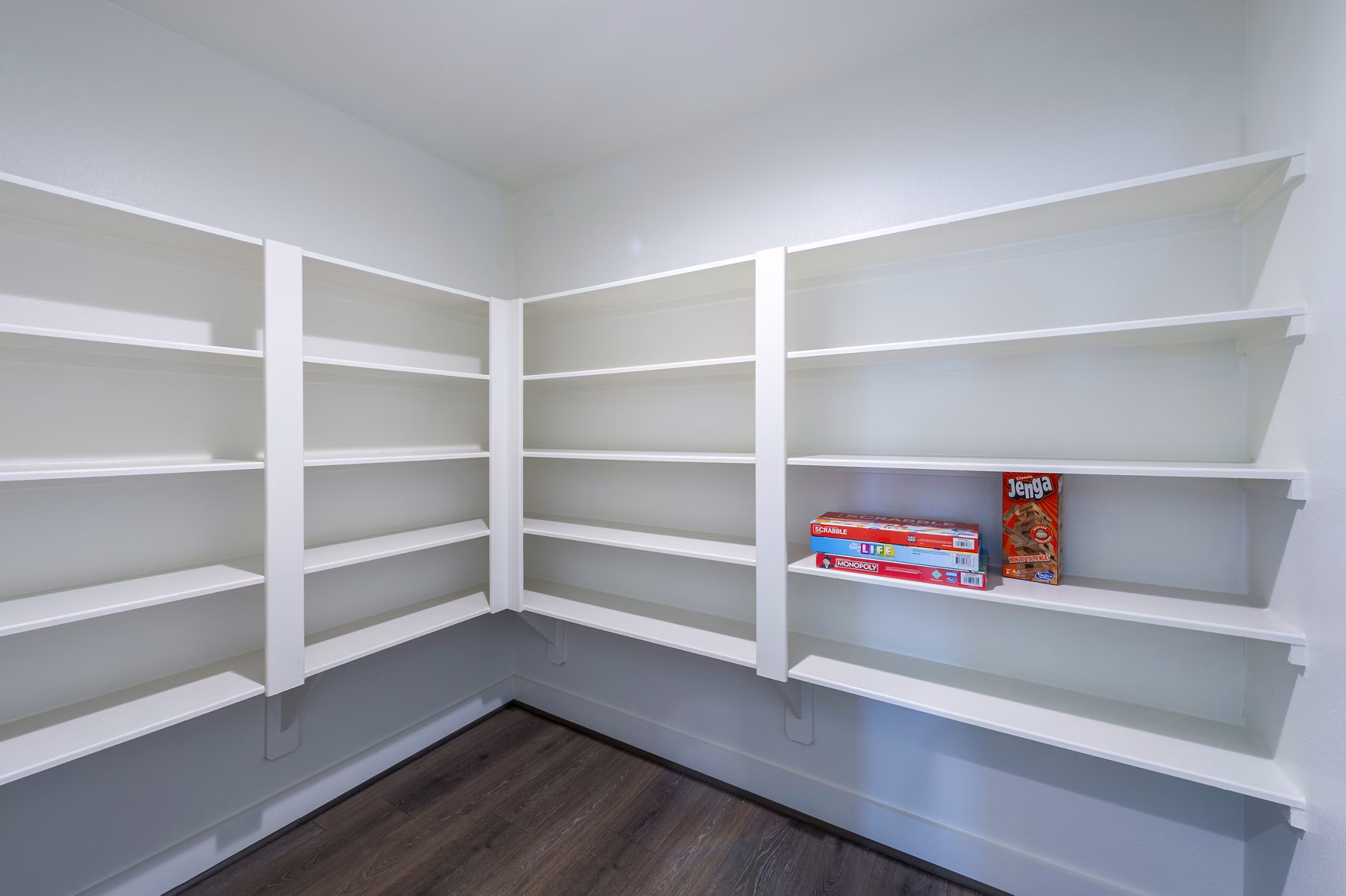 Spacious bedroom closet with open shelving in Eden at Sunterra Apartments, ideal for organized living in luxury surroundings