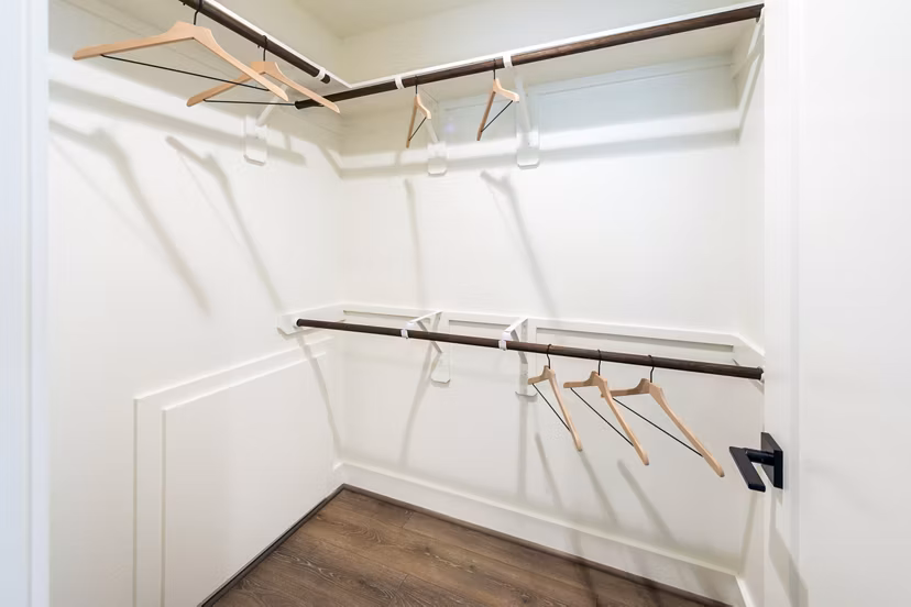 Spacious bedroom closet with personalized storage solutions in Eden at Sunterra Apartments
