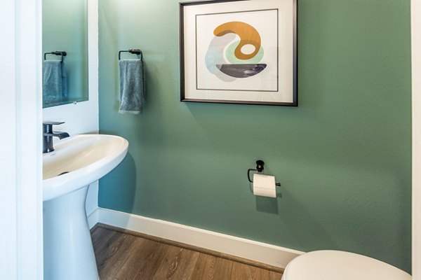 Luxurious bathroom with modern fixtures at Eden at Sunterra Apartments